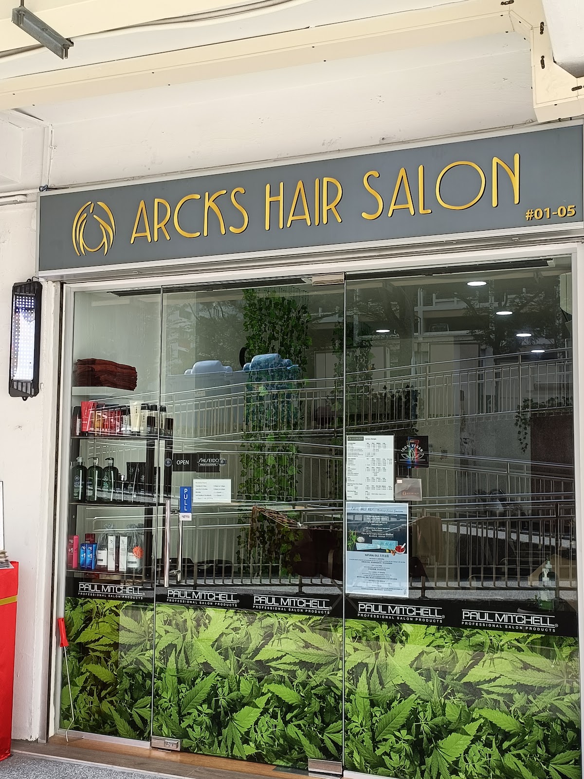 Arcks Hair Salon's storefront, grey and gold signboard at Blk 41 Holland Drive #01-05