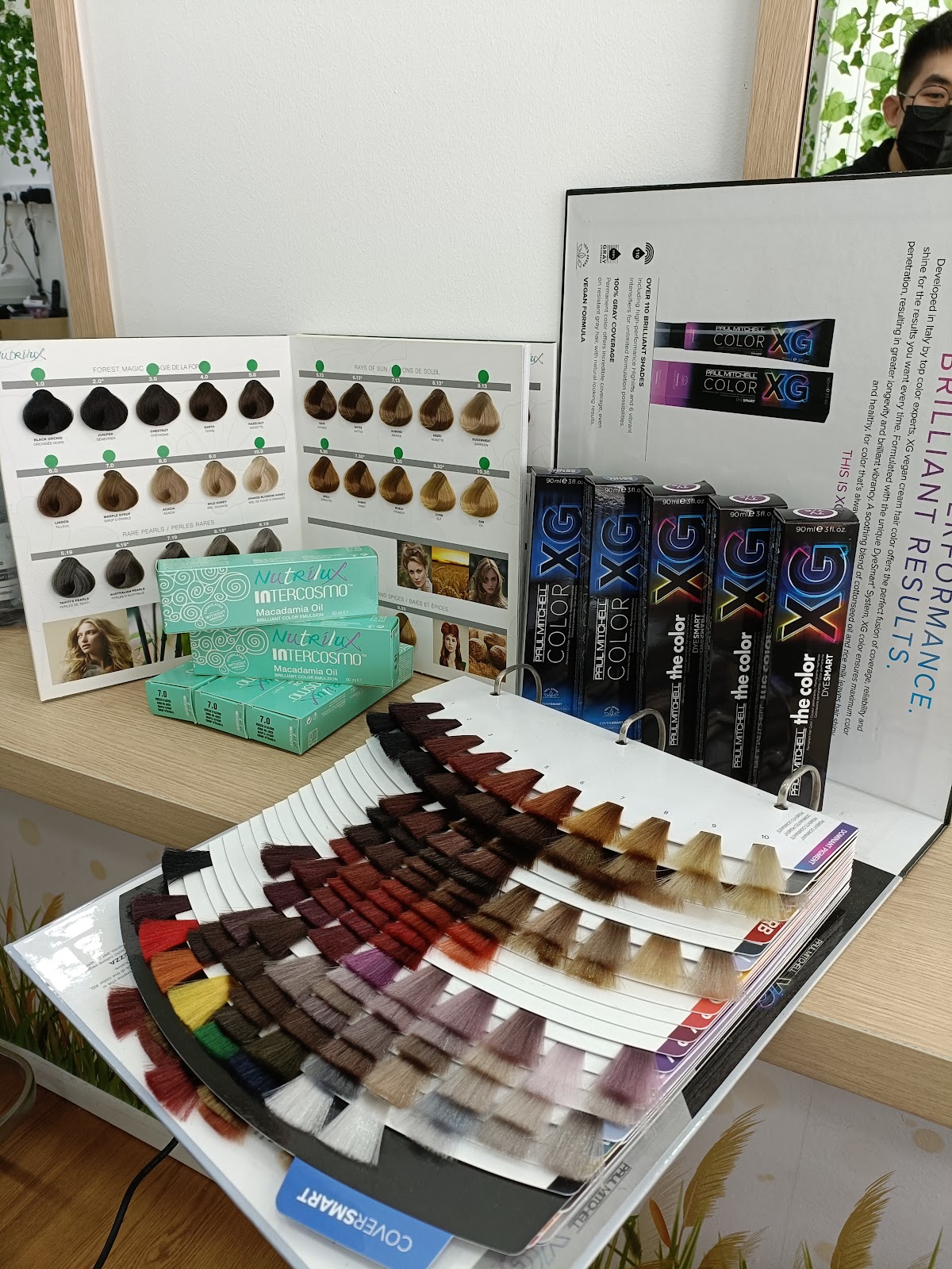 A display of professional colour products and a full colour swatch fan at the salon